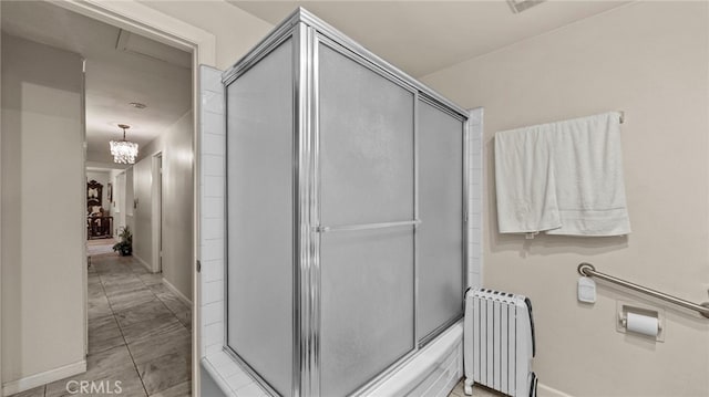 full bath featuring baseboards, tile patterned flooring, and radiator