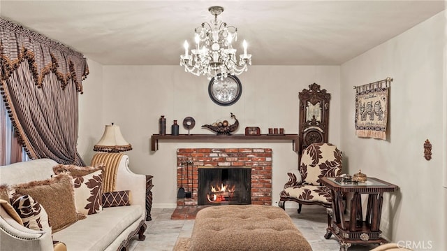 interior space with a brick fireplace and an inviting chandelier