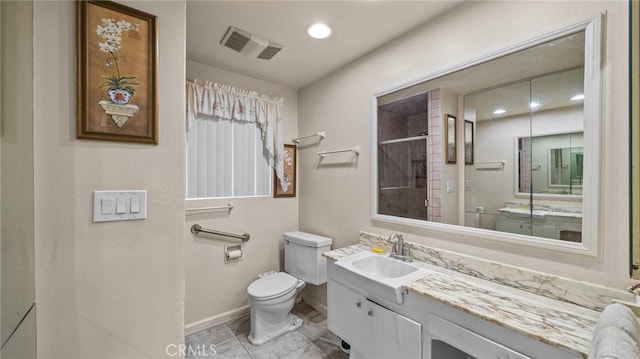 full bath featuring toilet, vanity, visible vents, baseboards, and walk in shower