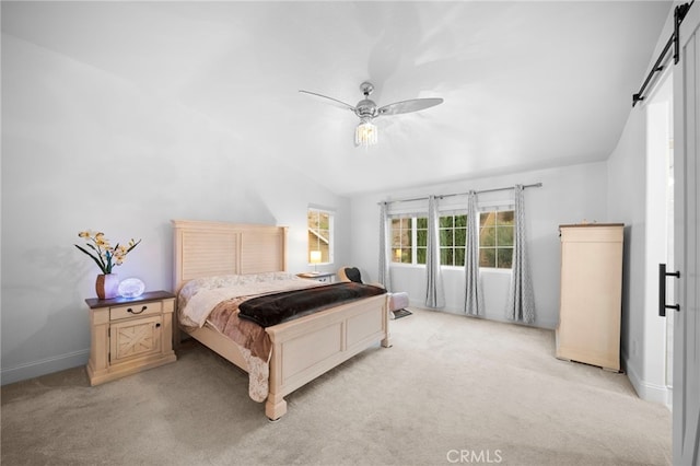 bedroom with light carpet, a barn door, baseboards, lofted ceiling, and ceiling fan