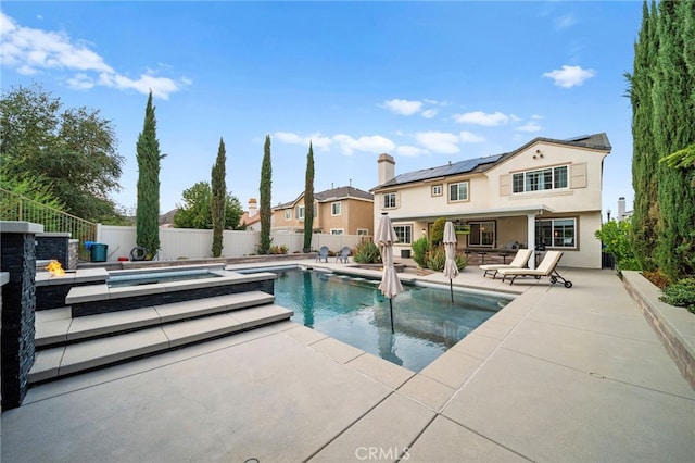 view of swimming pool featuring a patio area, a fenced backyard, and a fenced in pool