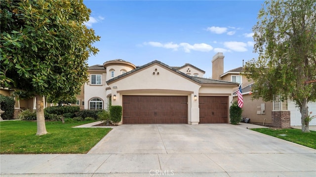 mediterranean / spanish house featuring a garage, stucco siding, concrete driveway, and a front yard