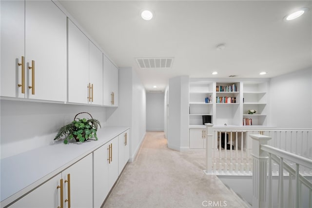 bar with baseboards, recessed lighting, visible vents, and light colored carpet