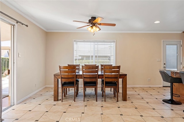 dining space with ornamental molding, ceiling fan, and baseboards