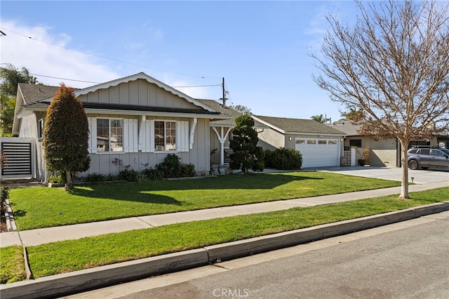 ranch-style house featuring board and batten siding, concrete driveway, a garage, and a front yard