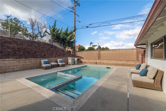 view of pool featuring a pool with connected hot tub, a fenced backyard, and a patio