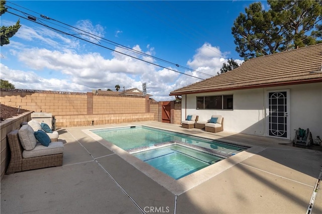 view of pool with a fenced in pool, a fenced backyard, an in ground hot tub, a patio area, and outdoor lounge area