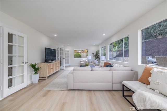 living room featuring french doors, wood finished floors, and recessed lighting