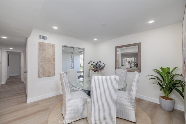 dining room with light wood-style flooring, visible vents, baseboards, and recessed lighting