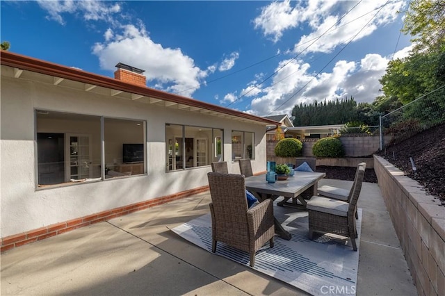 view of patio / terrace with a fenced backyard and outdoor dining area