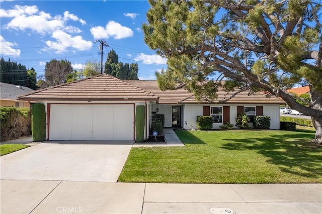 ranch-style home featuring a garage, driveway, a front lawn, and a tiled roof