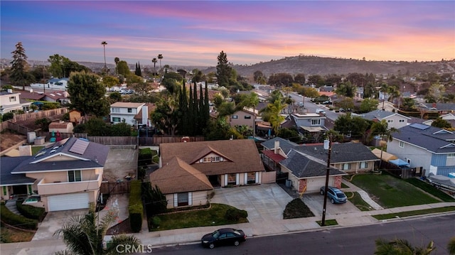 drone / aerial view featuring a residential view and a mountain view