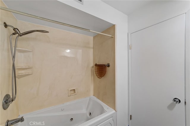 bathroom with a combined bath / shower with jetted tub