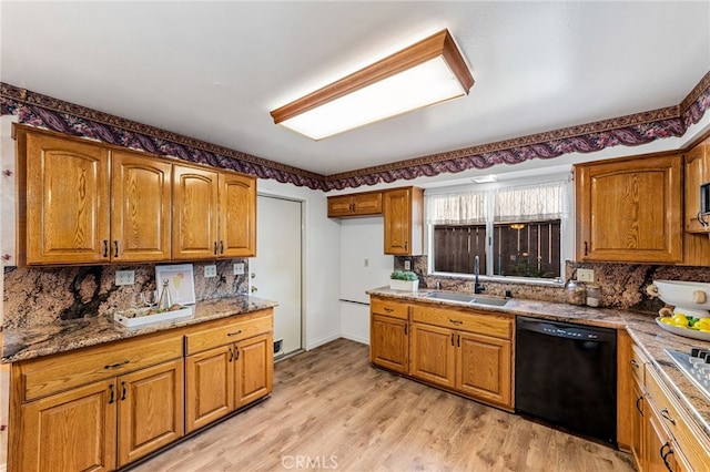 kitchen featuring a sink, brown cabinets, decorative backsplash, dishwasher, and light wood finished floors