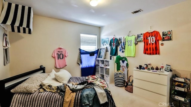 bedroom featuring carpet and visible vents