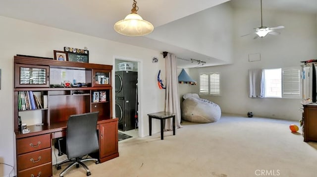 carpeted office with high vaulted ceiling and a ceiling fan