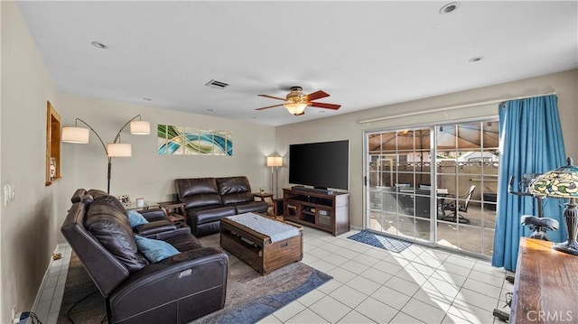 tiled living area with visible vents and ceiling fan