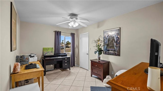 office space with light tile patterned floors and a ceiling fan