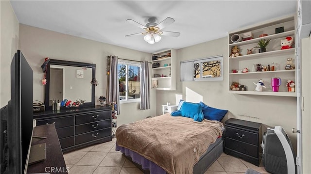 bedroom featuring light tile patterned flooring and ceiling fan