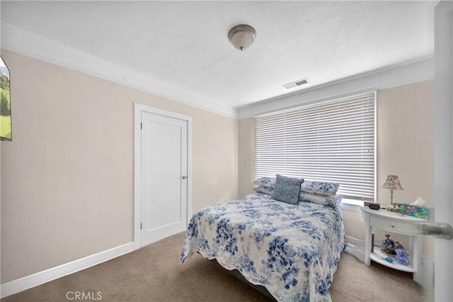 bedroom with carpet flooring, visible vents, and baseboards