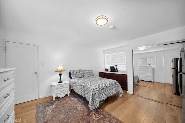 bedroom with light wood-style floors