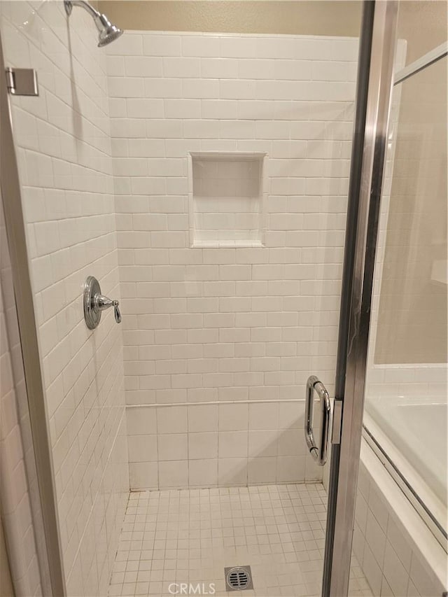 bathroom featuring a shower stall