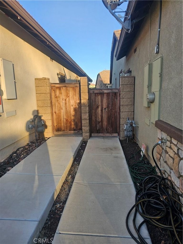 view of patio featuring a gate and fence