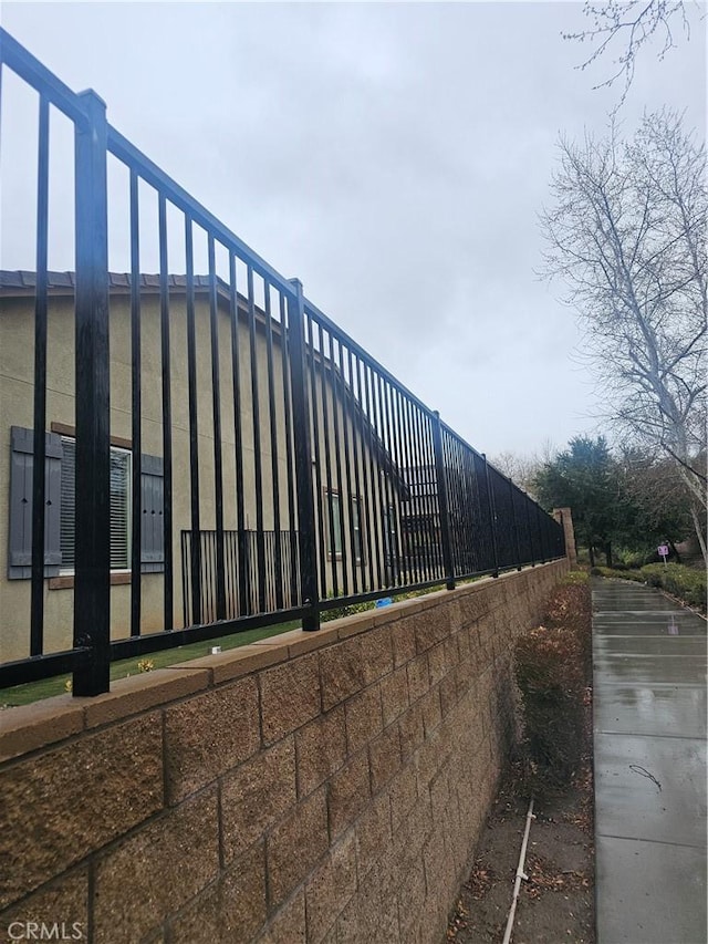 view of home's exterior featuring fence