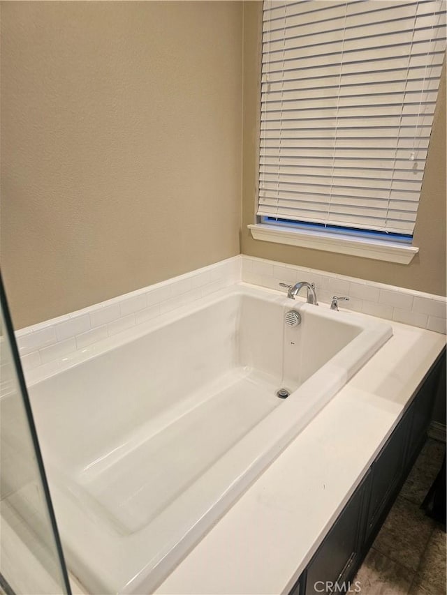 bathroom featuring a garden tub