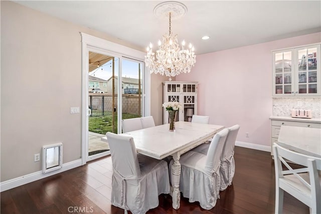 dining room featuring dark wood-style floors, recessed lighting, a chandelier, and baseboards