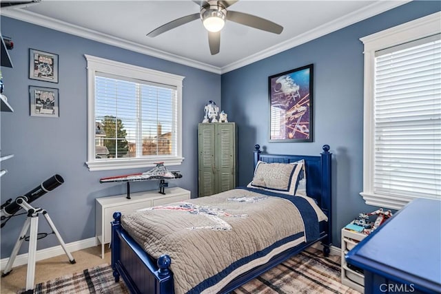 bedroom with carpet, baseboards, ornamental molding, and a ceiling fan