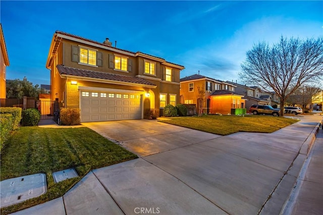 view of front of house with an attached garage, fence, driveway, a tiled roof, and stucco siding