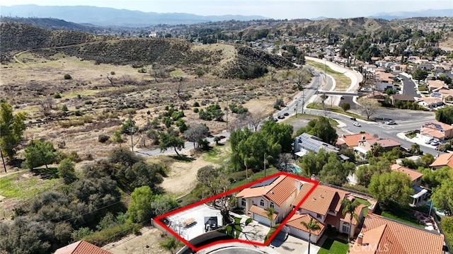 birds eye view of property with a residential view and a mountain view