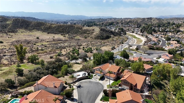 birds eye view of property with a residential view and a mountain view