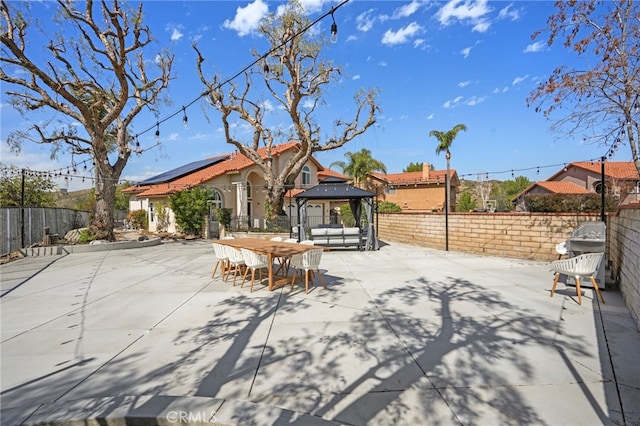 view of patio featuring a gazebo and a fenced backyard