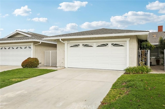 single story home with a garage, concrete driveway, roof with shingles, and stucco siding