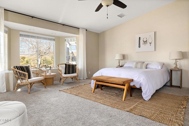 bedroom with visible vents, lofted ceiling, carpet floors, and ceiling fan