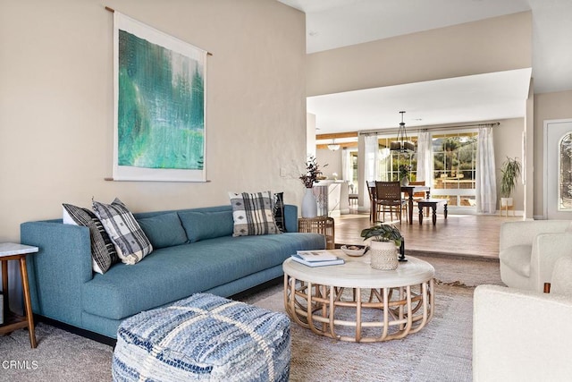 living room with baseboards and wood finished floors