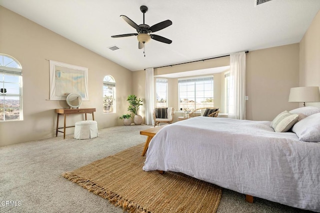 bedroom featuring visible vents, carpet floors, ceiling fan, and vaulted ceiling