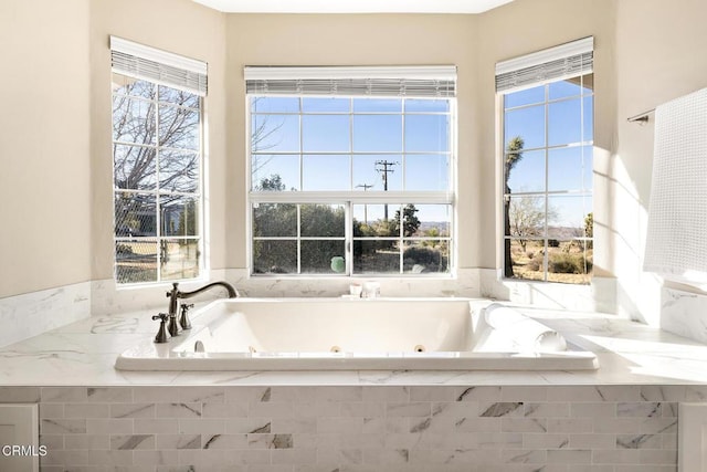 full bath with a whirlpool tub