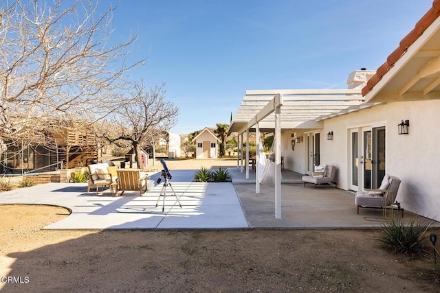 view of patio / terrace featuring french doors and a pergola