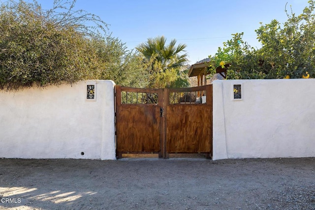 view of gate featuring fence