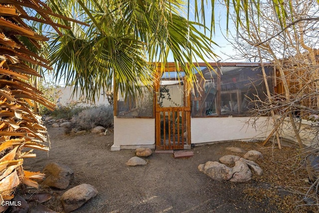 exterior space with stucco siding