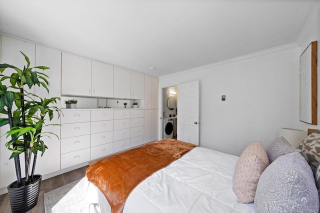 bedroom with stacked washer / dryer, wood finished floors, and crown molding