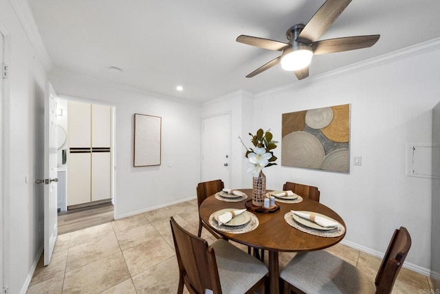 dining room featuring light tile patterned floors, ceiling fan, baseboards, and crown molding