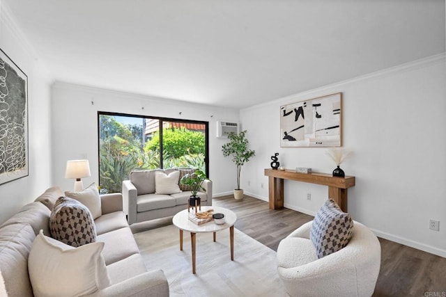 living room featuring baseboards, ornamental molding, and wood finished floors