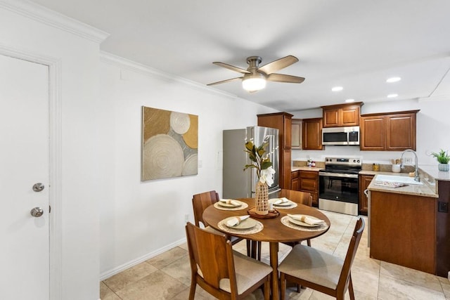 dining room with ceiling fan, ornamental molding, recessed lighting, and baseboards