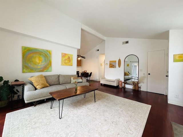 living room featuring high vaulted ceiling, visible vents, and wood finished floors