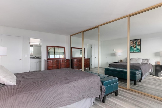 bedroom with light wood-style flooring