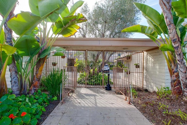 exterior space featuring fence and a gate